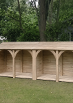 Uk log store in garden with 4 bays.